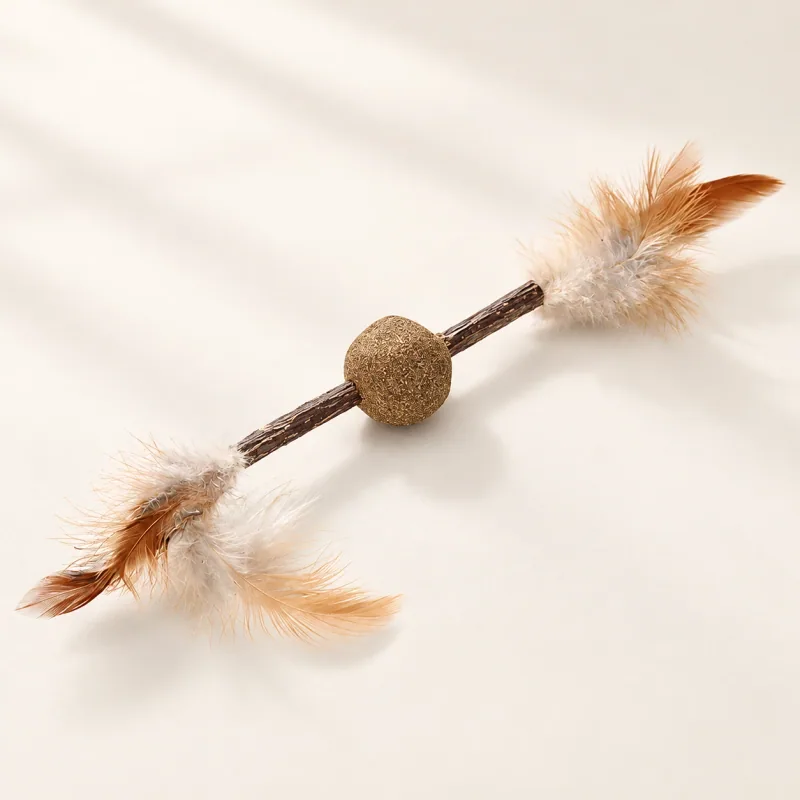 One silvervine stick with a central catnip ball and feather tufts at both ends.