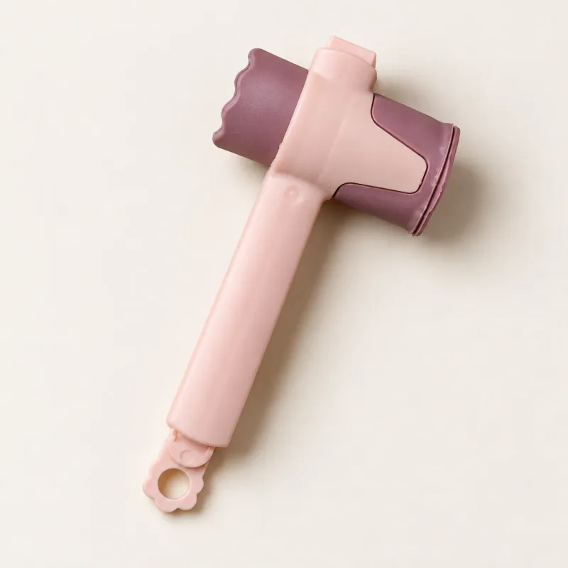 One blush-pink bag clip with a mauve pouring spout and hanging loop