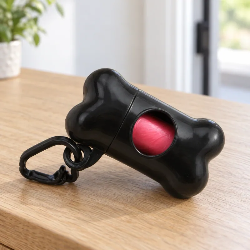 One black holder with attached clip and one starter roll of 15 unprinted bags. Bag color may vary.