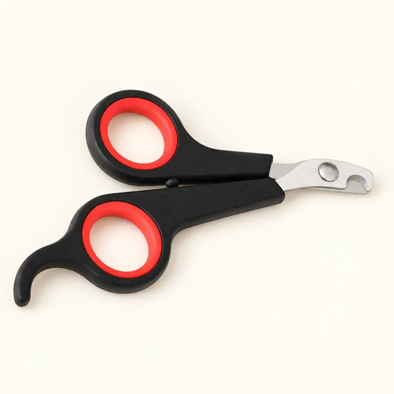 Small stainless steel pet nail clippers with black and red handles