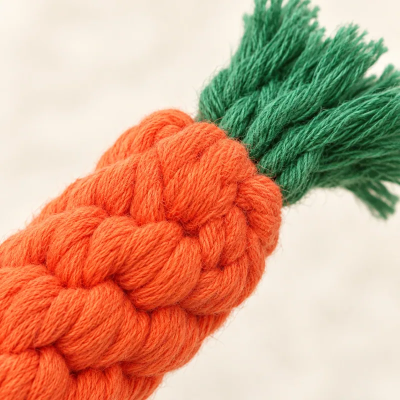 Close detail of the orange rope and green tassel junction