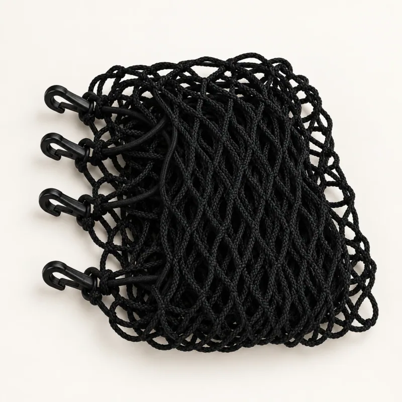 Folded black mesh car divider with four attached black plastic snap hooks