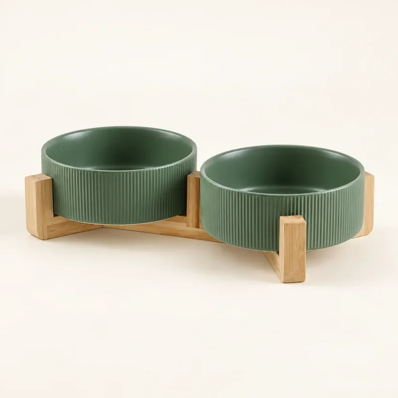 Two olive ribbed ceramic bowls in their low wooden stand, viewed to show the empty interiors.